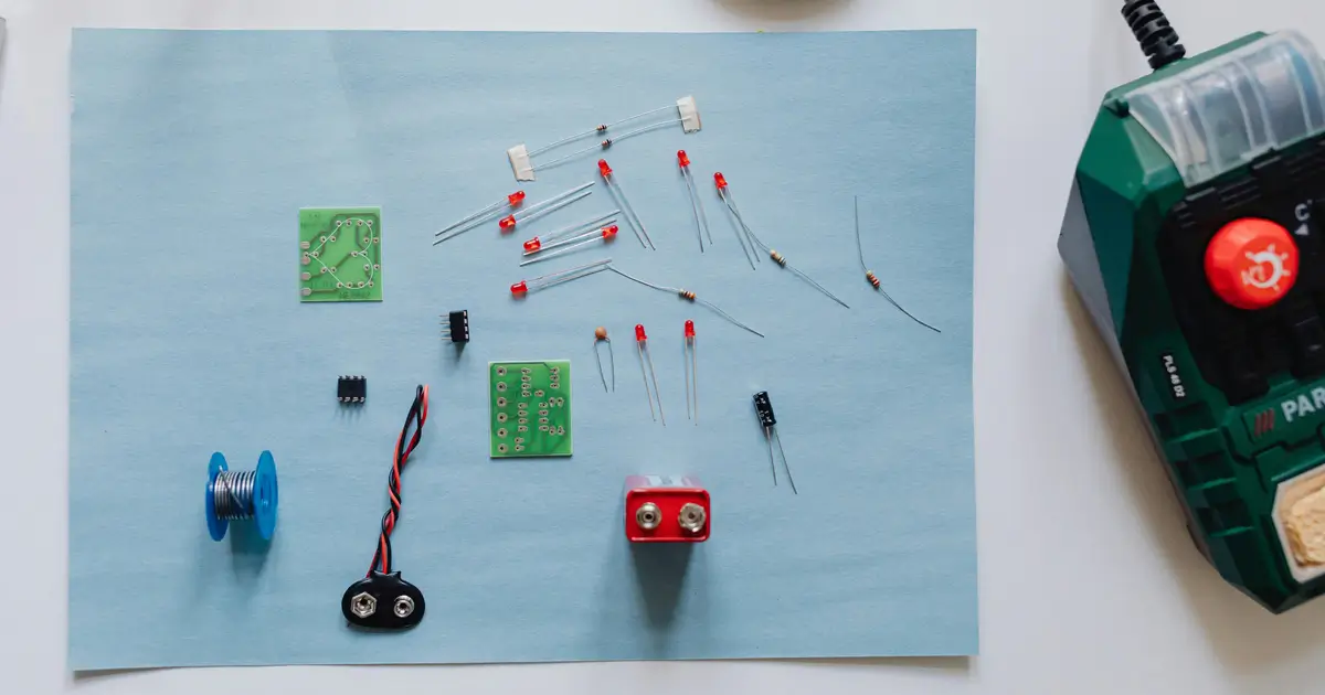 Light Up Characters Circuits and Creativity Steam Futures Workshop Series A set of LEDs soldering iron and a battery on a table